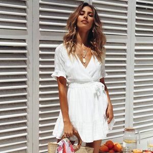 White wrap mini dress with plunge neckline